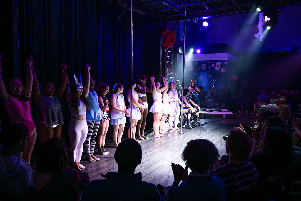 Adult cast taking a bow together at a Luna Aerial Dance showcase · Erin White Photography
