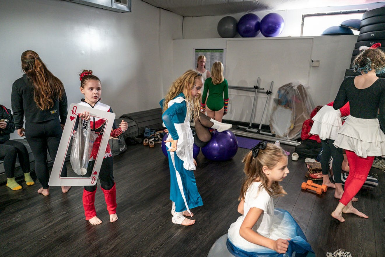 Youth cast getting ready together in the studio before a show